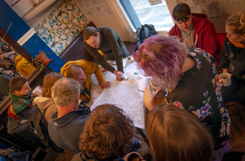 Event participants gather around historical maps of the Greenheys area. Photo credit: Jenna Bowyer.